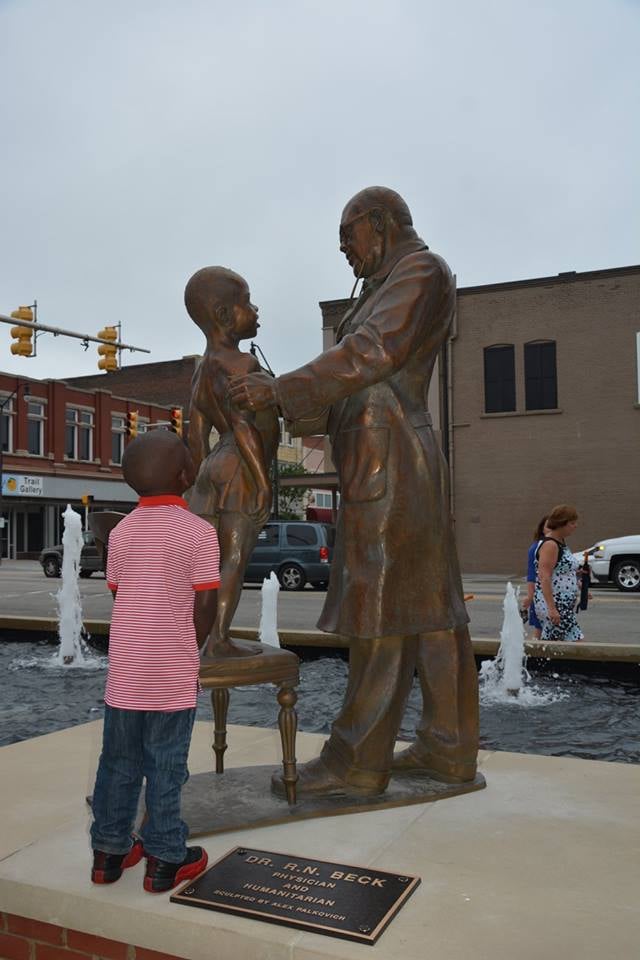 Young model with his sculpture
