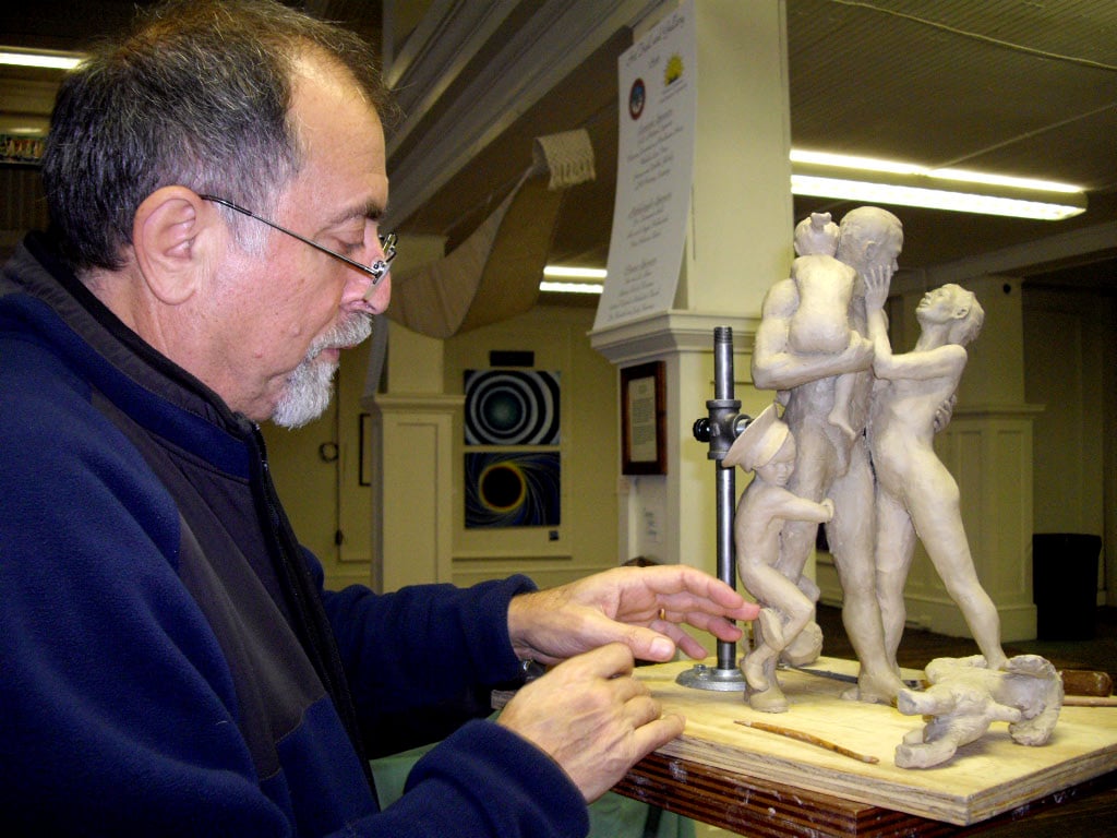 Alex works on a small version of what will later become the large Home Safe sculpture.