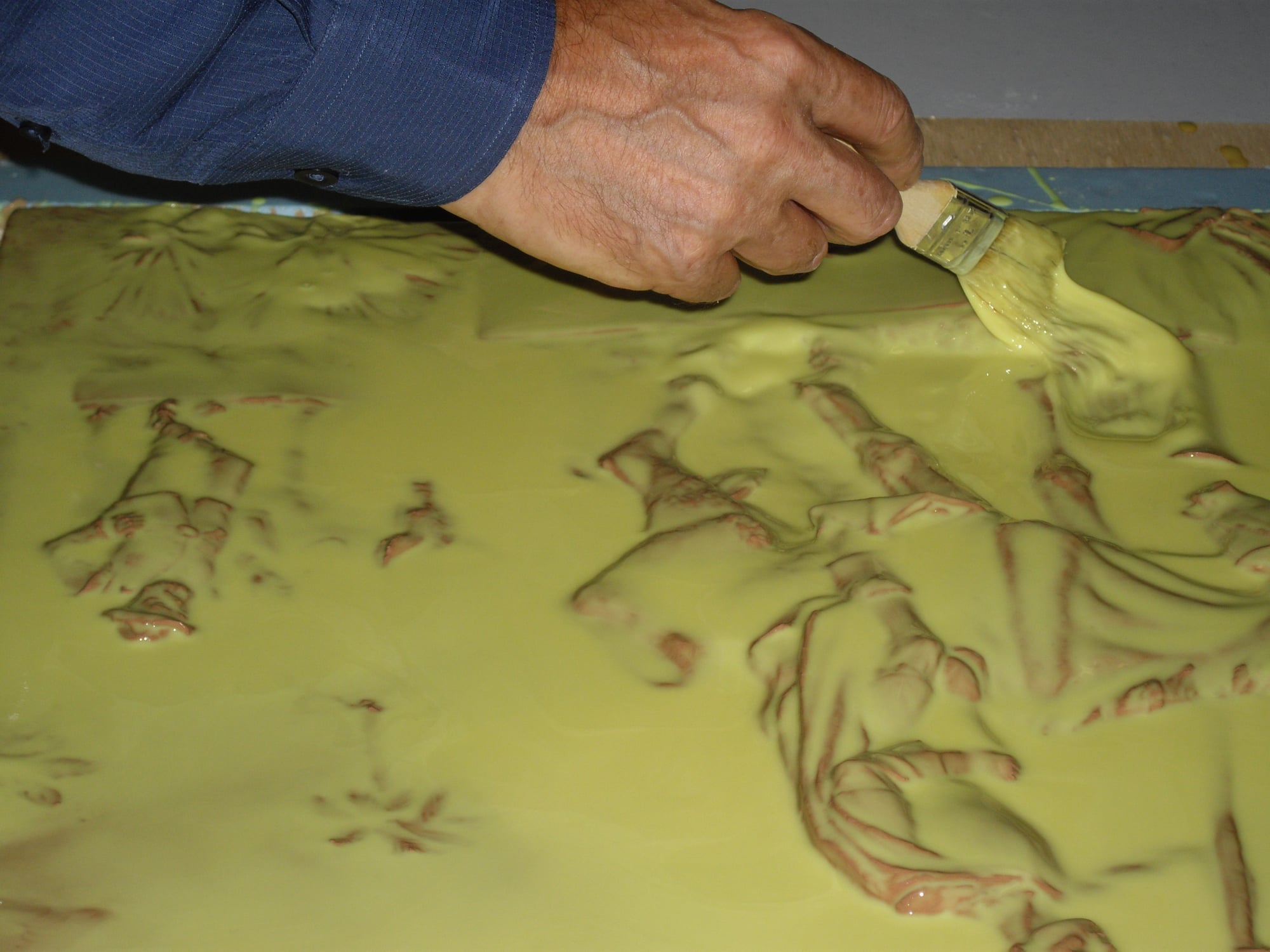Alex is working on a mold.